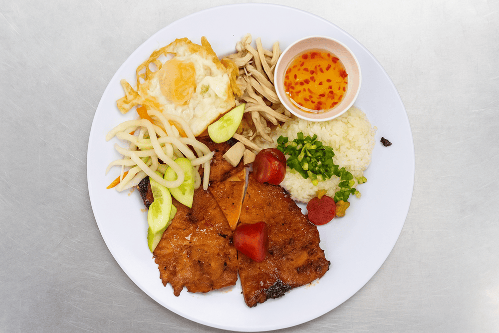 The “extra-large” marinated pork chop with smoky charred edges is the restaurant’s unmistakable signature